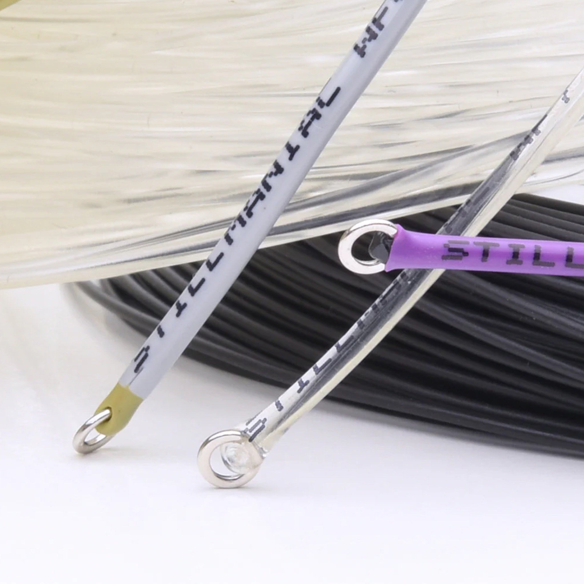 Close-up of Vision Stillmaniac fly lines with color-coded markers and printed line type near the tippet ring