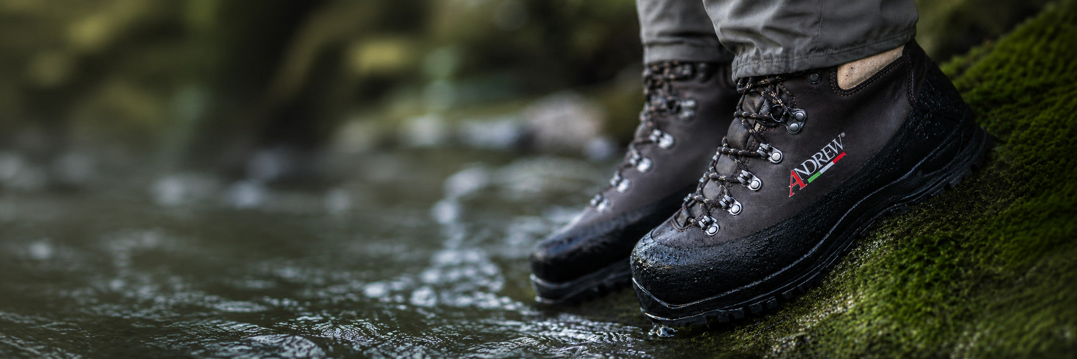 Andrew fly fishing boots on a rocky riverbank, designed for demanding wading conditions