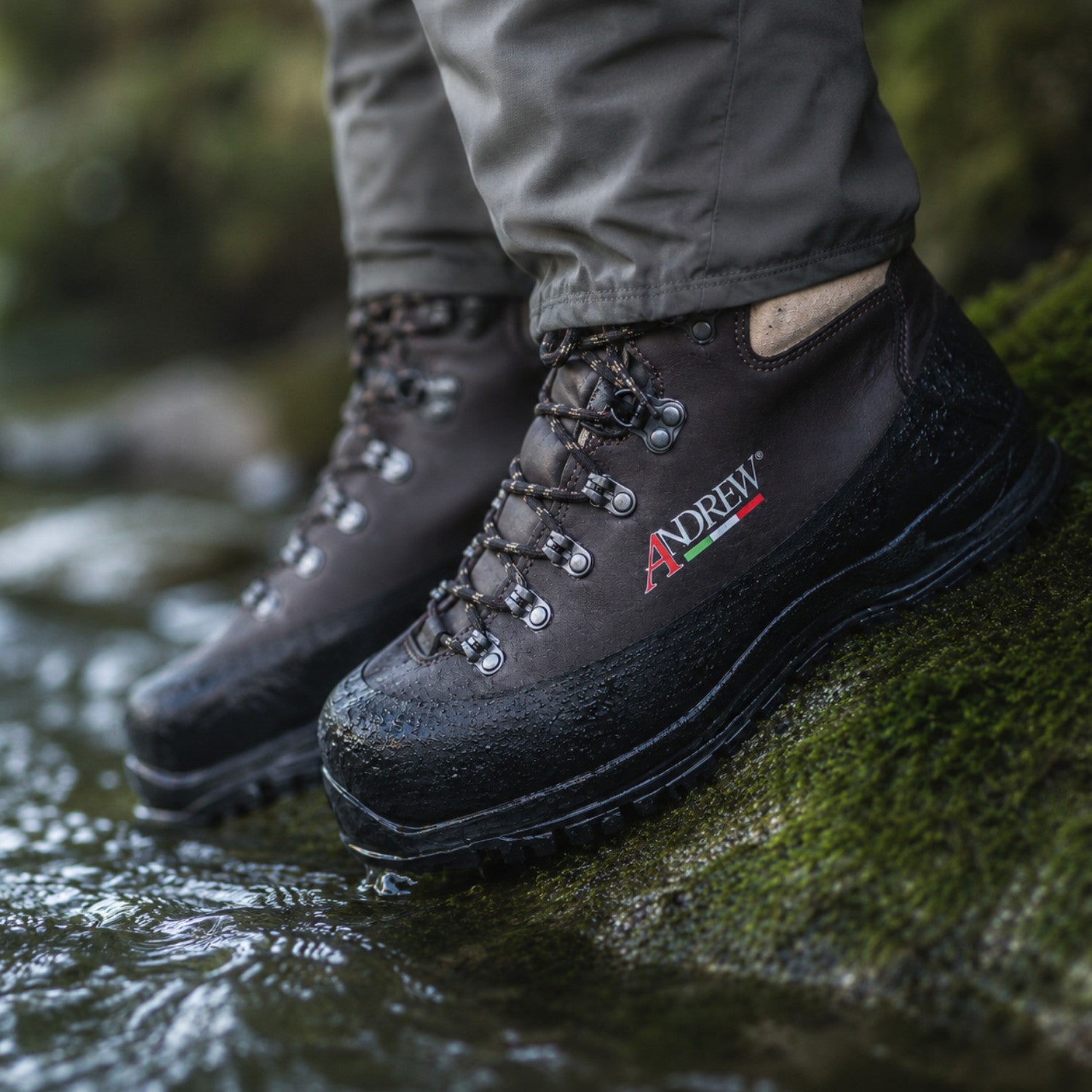 Andrew Fly V2 wading boots on wet river rocks during fly fishing