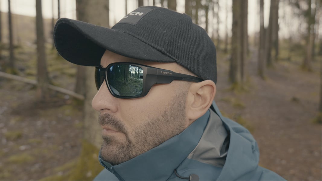 Angler wearing Leech X1 Water polarized fishing sunglasses during an outdoor fishing trip