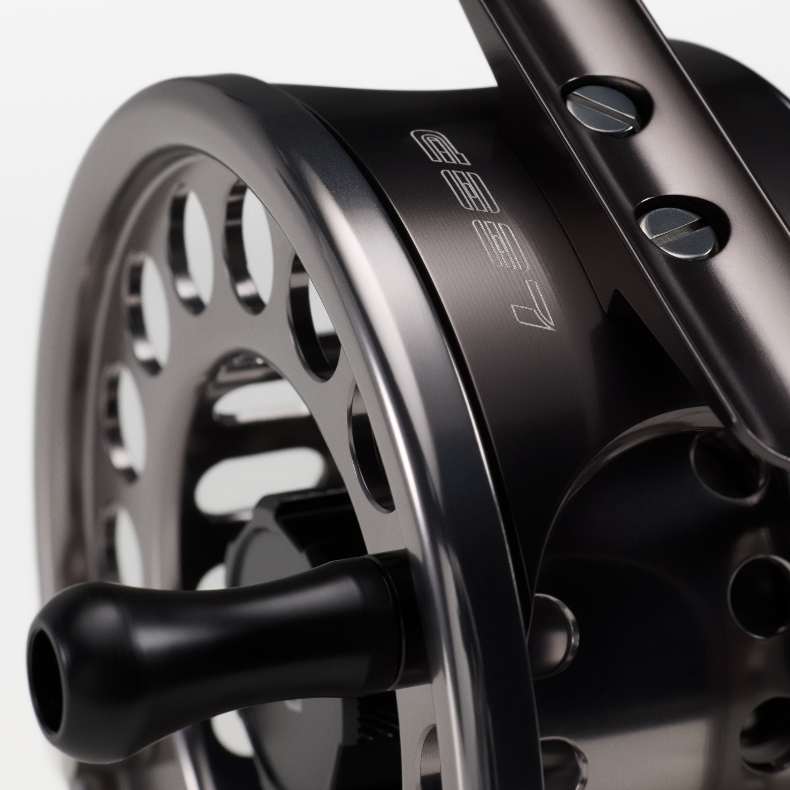 Close-up detail of the handle and machined frame on a LOOP Evotec G5 fly reel