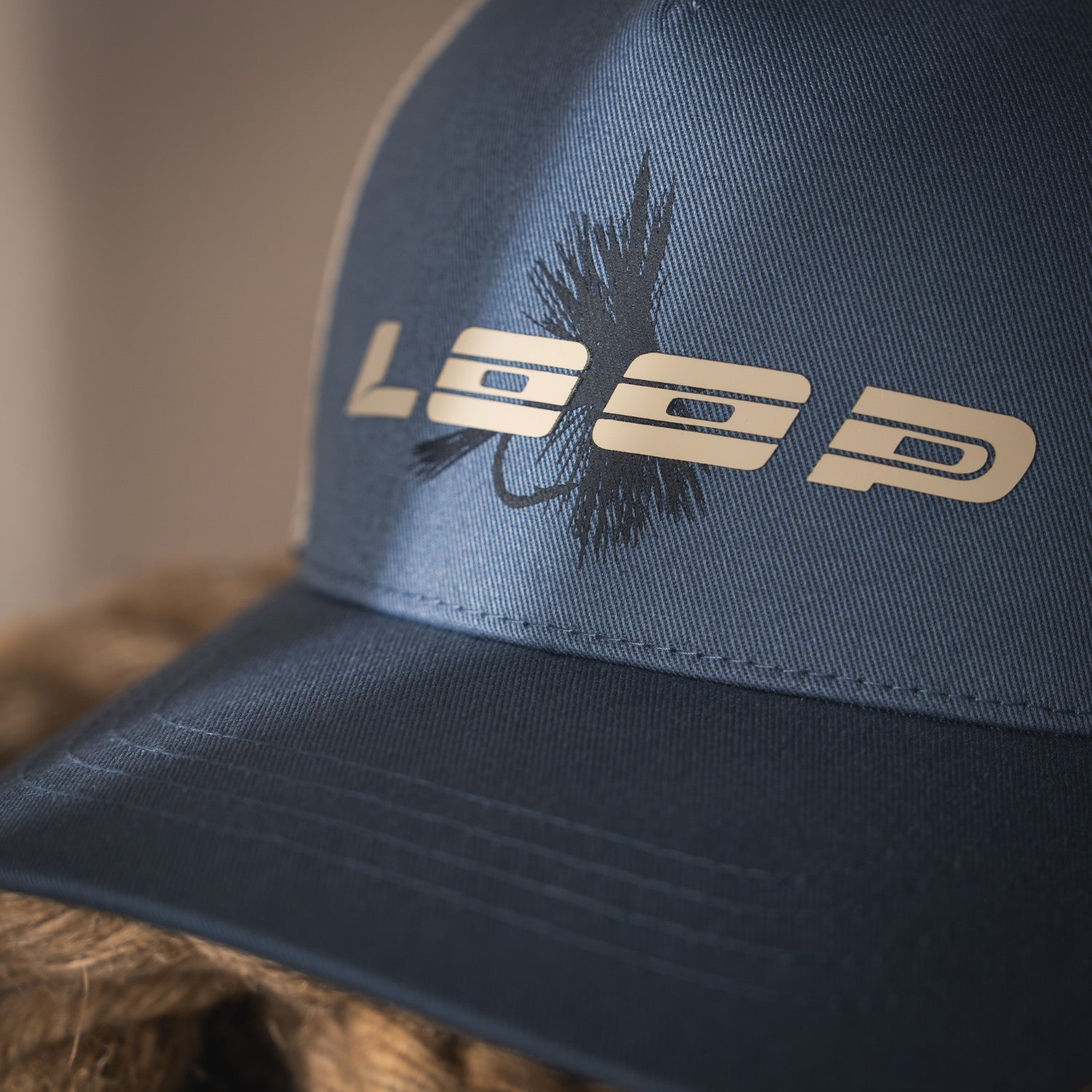 LOOP Fly Trucker Cap Blue Gray logo detail