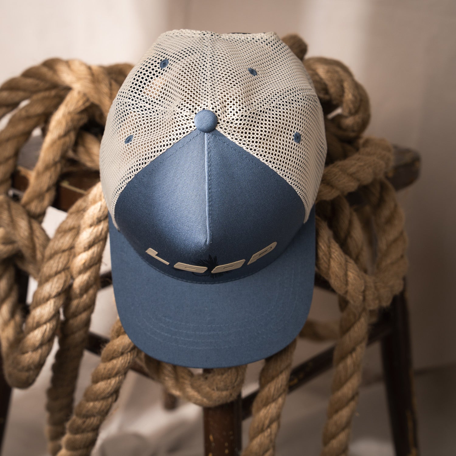 LOOP Fly Trucker Cap Blue Gray top view with mesh back