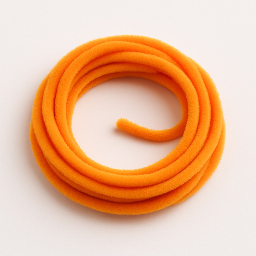 Eggs Orange Soldarini Wormstasy Chenille fly-tying material, close-up pulsing fiber texture, studio lighting