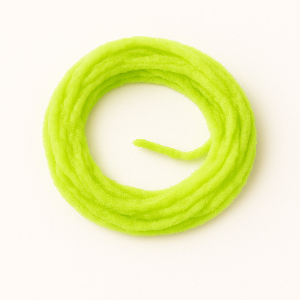 Sunburst Yellow Soldarini Wormstasy Chenille fly-tying material, close-up pulsing fiber texture, studio lighting